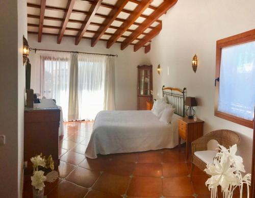 En eller flere senge i et værelse på Villa Victoria