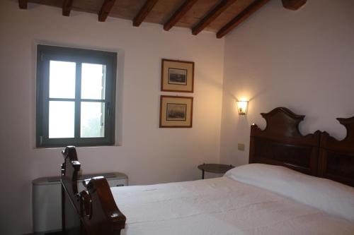מיטה או מיטות בחדר ב-Il Gesuita