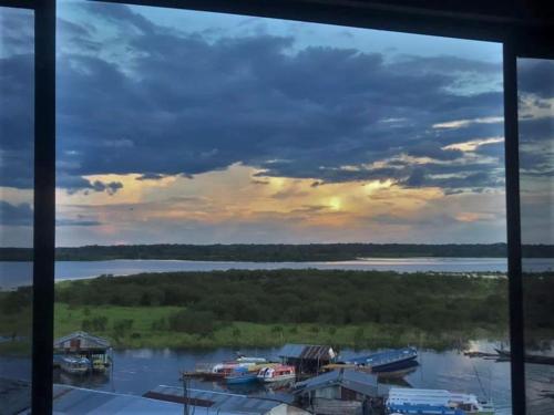 a view of a river from a window at Amazon Dream Hostel with AC and Starlink in Iquitos
