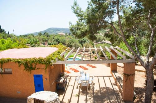 a view of a house with a porch with a deck at Finca Pessal in Caʼs Concos