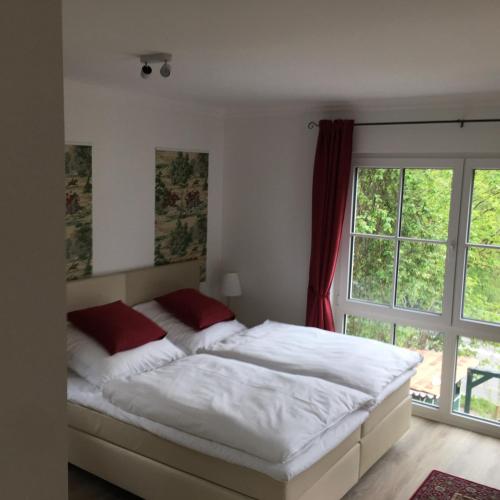 a bedroom with a bed and a window at Altes Forsthaus Waldenbuch / Bei der Messe Stuttgart in Waldenbuch