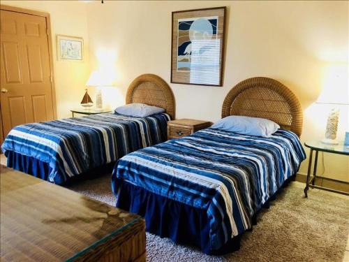 a hotel room with two beds and a table at Saida IV Condos S4308 in South Padre Island
