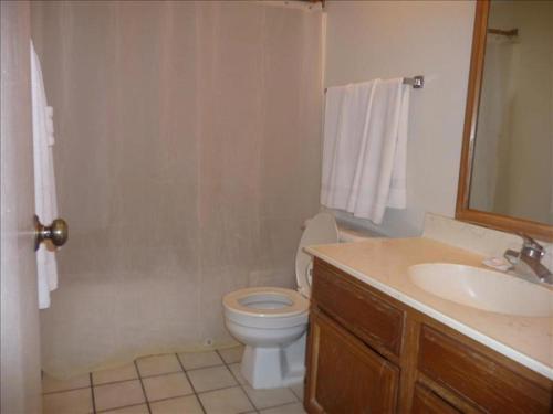 a bathroom with a toilet and a sink at Florence I Condos F1705 in South Padre Island