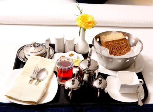 a tray with a table with a trayasteryasteryasteryasteryasteryasteryasteryastery at Residency Tower in Trivandrum