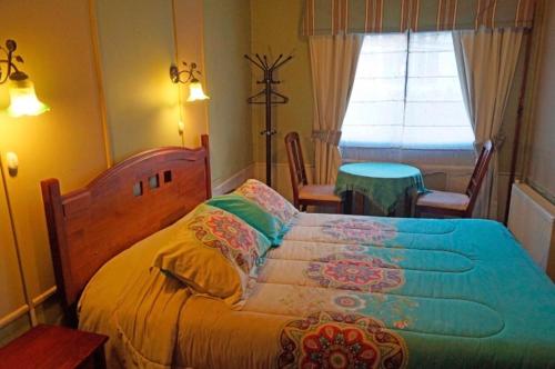 Postel nebo postele na pokoji v ubytování Hostal del Muelle