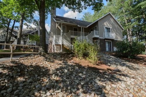 a house with a stone driveway in front of it at Residences at Daniel Webster in Merrimack