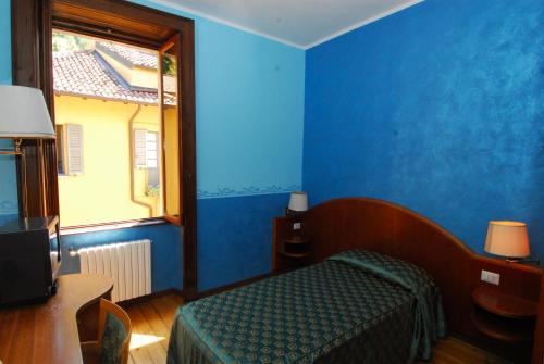 Postel nebo postele na pokoji v ubytování Fiò & Giò