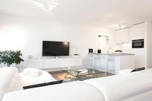 
A television and/or entertainment center at Luxury Suite Koksijde 301 Adult only
