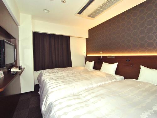Postel nebo postele na pokoji v ubytování Hotel Mark-1 Abiko