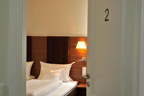 Postel nebo postele na pokoji v ubytování Hotel Restaurant Zeiskamer Mühle