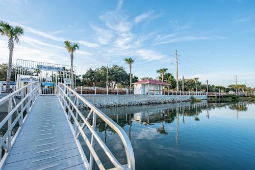 a bridge over a body of water with palm trees at Romantic Escape in Downtown St Augustine in Saint Augustine