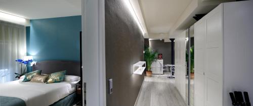 a bedroom with a bed and a bathroom at Pensión Plaza Nueva in Bilbao