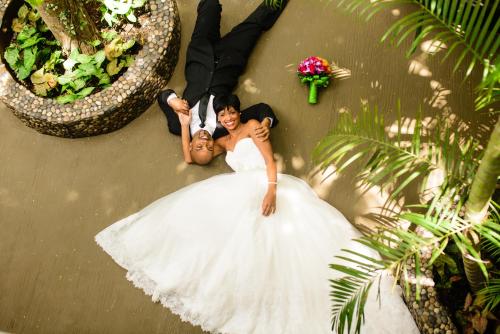 a bride and groom posing for a picture in their wedding dress at Terra Nova, BW Premier Collection in Kingston