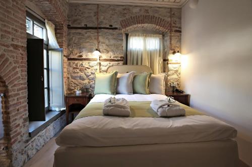 Postel nebo postele na pokoji v ubytování Hotel Doltso