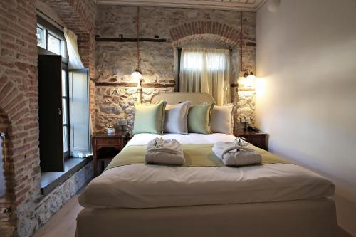 Ένα ή περισσότερα κρεβάτια σε δωμάτιο στο Hotel Doltso