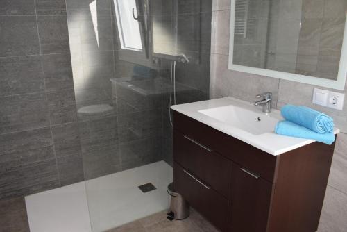 a bathroom with a sink and a shower at casa con piscina privada y cerca playa ref 382 in Empuriabrava