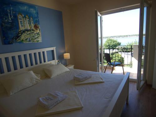 Llit o llits en una habitació de Apartments Villa Papalina 2