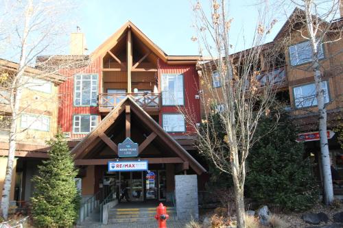 a building with a fire hydrant in front of it at Marketplace Lodge by Whistler Retreats in Whistler