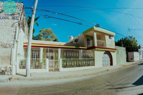 a building on the side of a street at Casa Lool Beh in Mérida