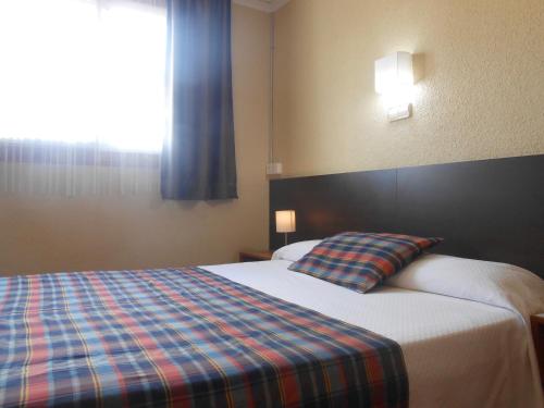 Katil atau katil-katil dalam bilik di Hostal El Callejón