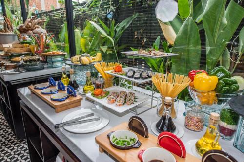 a buffet of food and drinks on a table at The Villa by Metta in Siem Reap
