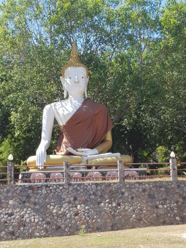 a large statue of a woman sitting on a wall at Plaza Huahin in Hua Hin