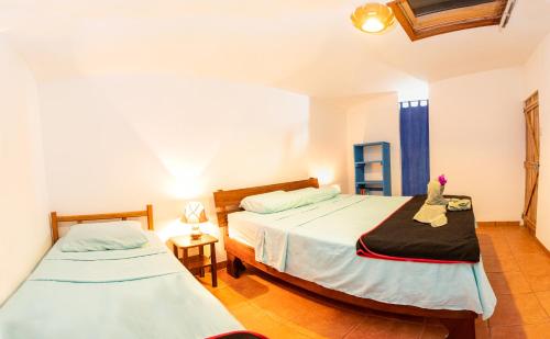 Postel nebo postele na pokoji v ubytování Pochote Lodge