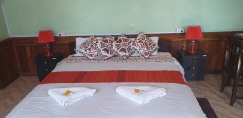 A bed or beds in a room at Pukyo Bed and breakfast Belgian lao