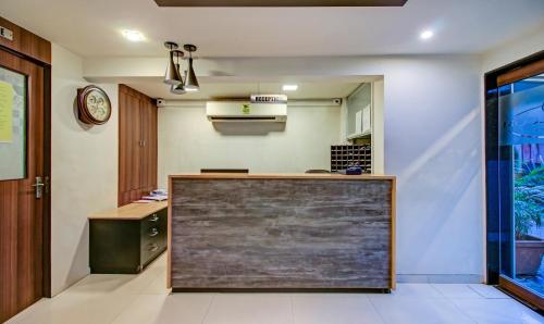 a kitchen with a counter in a room at Treebo Trend Lake Bloom Powai in Mumbai