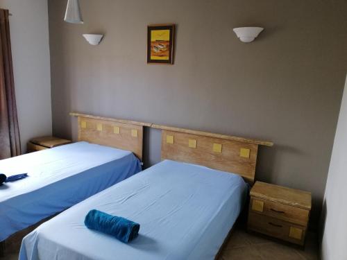 Giường trong phòng chung tại Montagu Villa, Flic en Flac, Mauritius