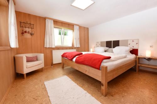 A bed or beds in a room at Familienbauernhof Köss Schertler