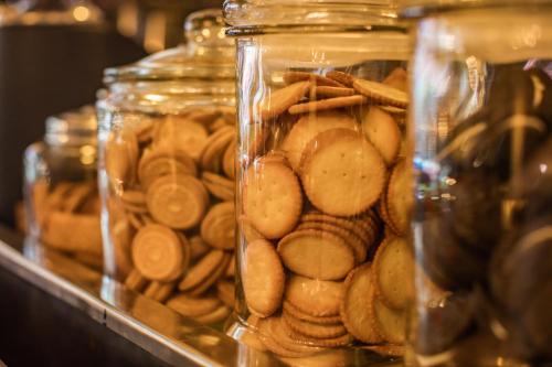 a group of glass jars filled with cookies at Pro Andaman Place in Karon Beach