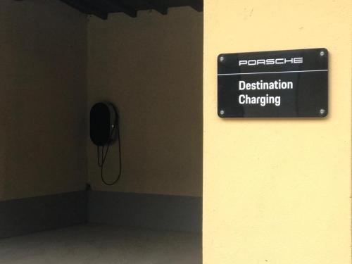 a sign on a wall in a room with a phone at Agriturismo Tenuta "Il Cigno" in Villanterio