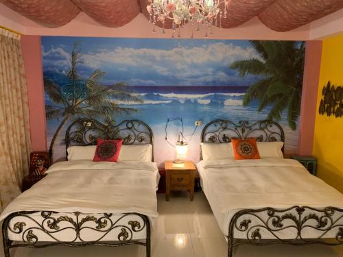Postel nebo postele na pokoji v ubytování Hualien Seaside B&B