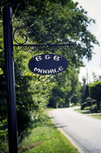 a sign that reads gas magic on the side of a road at B&B Maarle in Poppel