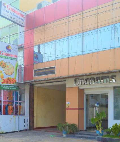 a store front of a building with a colorful facade at Gnaanams Hotel and Restaurant in Jaffna