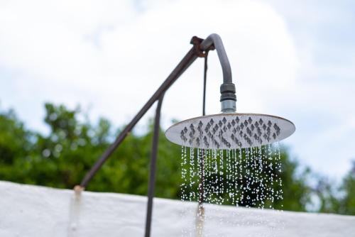 a shower with water coming out of it at Stellenhof Country Estate in Addo