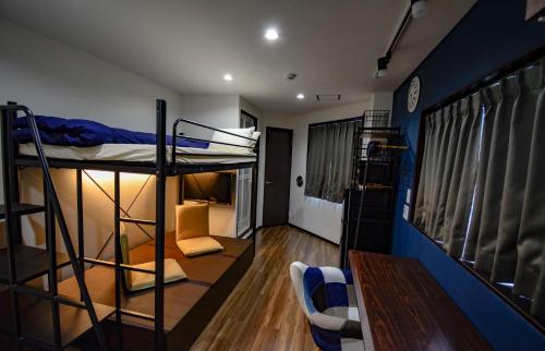 a dorm room with two bunk beds in it at 043AKIHABARA in Tokyo