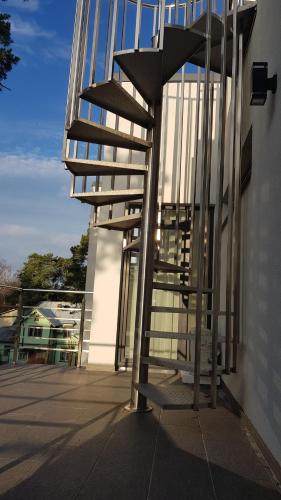 a metal staircase on the side of a building at Black Pearl Apartments in Jūrmala
