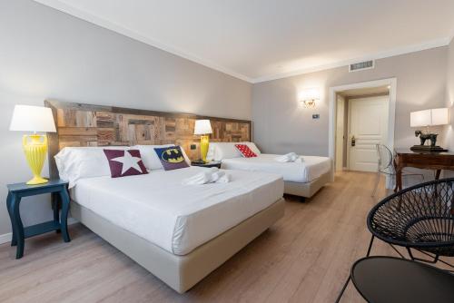 Postel nebo postele na pokoji v ubytování Hotel Leon d'Oro