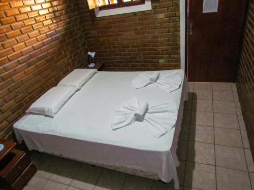 Un ou plusieurs lits dans un hébergement de l'établissement Real Pousada
