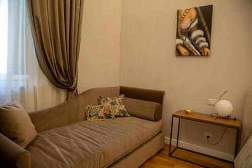 a living room with a couch and a table at Dimora Storica Lo Svevo in Iesi
