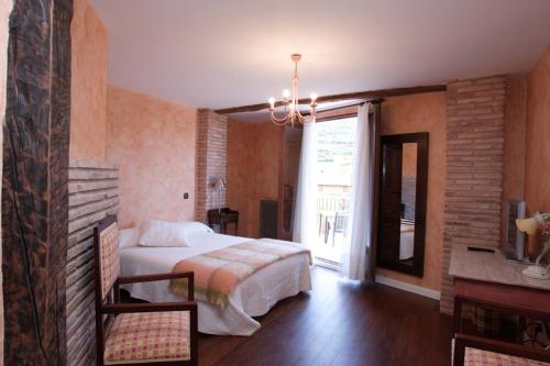 A bed or beds in a room at La Casona del Pastor