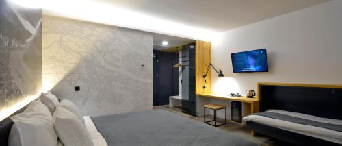 TV a/nebo společenská místnost v ubytování Hotel CityMap Maribor