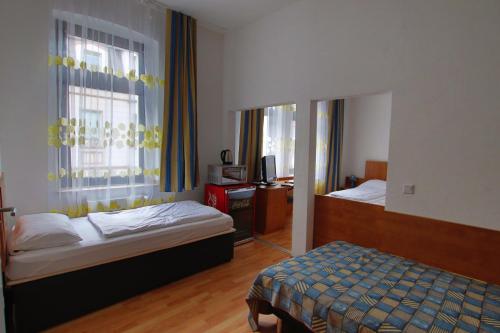 Ένα ή περισσότερα κρεβάτια σε δωμάτιο στο City Lounge Hotel Oberhausen