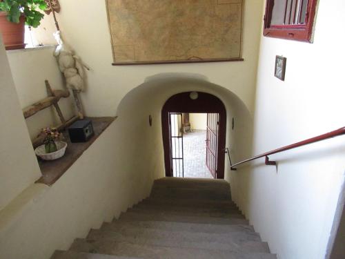 a stairway leading up to a door in a building at Ferdinand Apartments in Mediaş