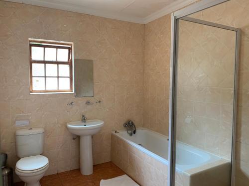 Ванная комната в Ivory Lodge Bendor