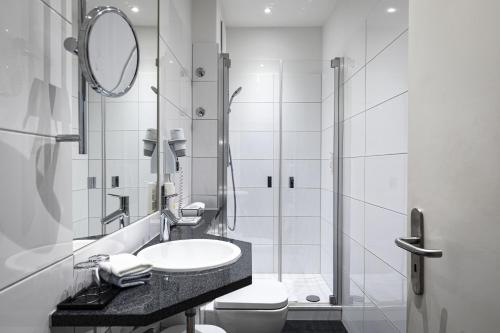 Koupelna v ubytování Dom Hotel