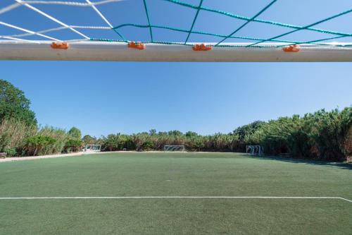 an empty soccer field with a net at Marino Mobilhomes in Grimaud