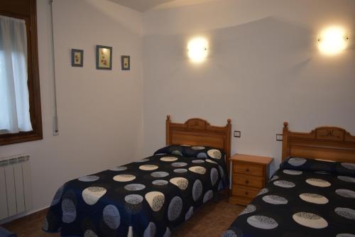 Postel nebo postele na pokoji v ubytování Apartamentos Casa Esperanza - Ordesa